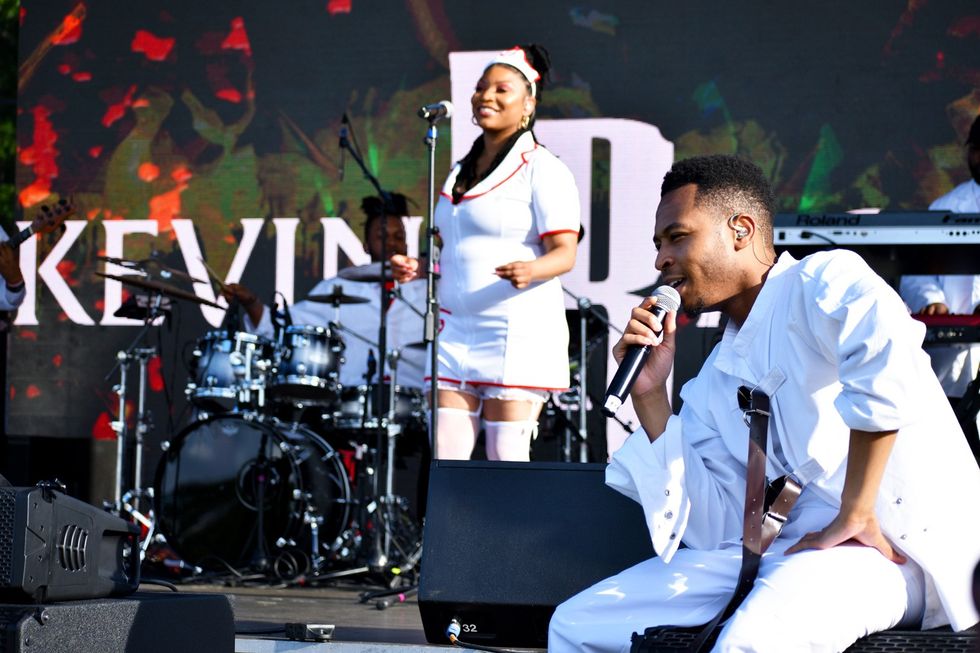 A Berklee alum from Baltimore, Kevin Ross starts his BAMSFest set in a straightjacket, covering \u201cCrazy\u201d by Gnarls Barkley while his back-up singers escort him to the mic in Franklin Park, June 24, 2023.