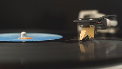 A vinyl record spins under an Ortofon N120 needle.