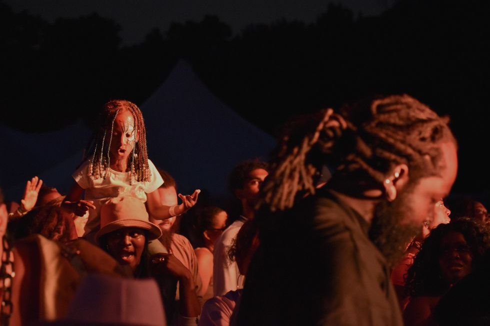 A young girl gets a great vantage point to enjoy Grandmaster Flash from a moving seat in the middle of the crowd at BAMSFest in Franklin Park on June 24, 2024.