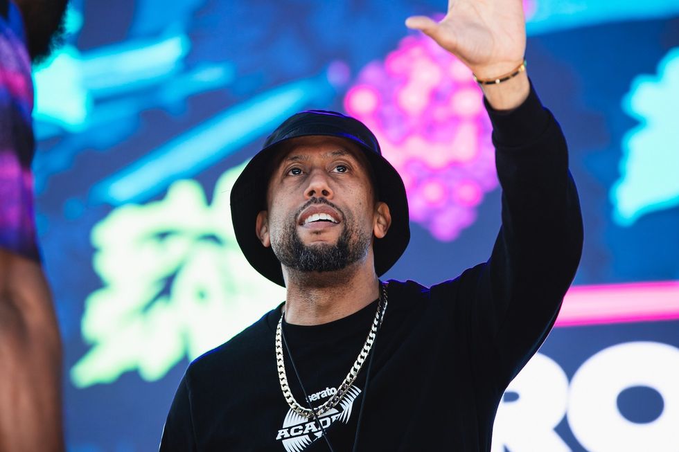 Affion Crockett smiling with his hand in the air