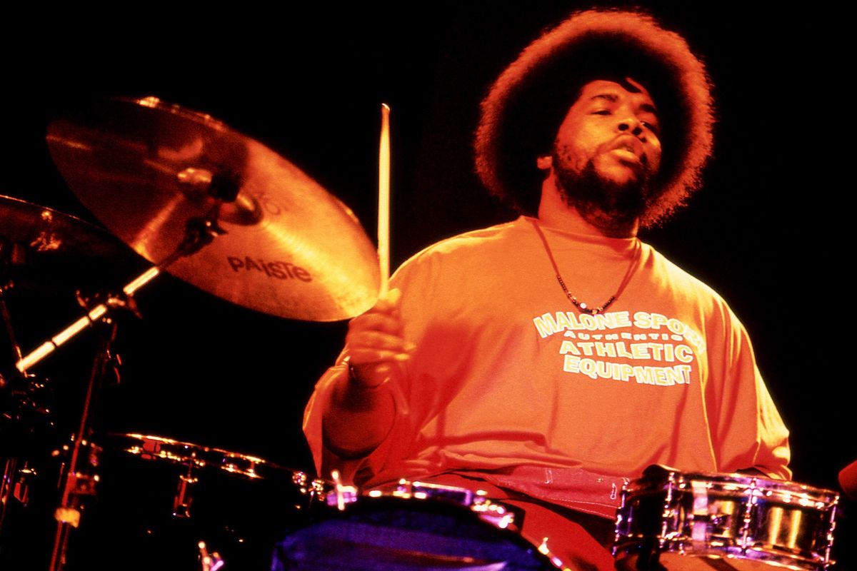 American musician, record producer, disc jockey, filmmaker, music journalist, and actor Questlove Ahmir Khalib Thompson, of the American hip hop band The Roots, plays on stage during JazzFest at The Knitting Factory in New York, New York, circa 2000. 