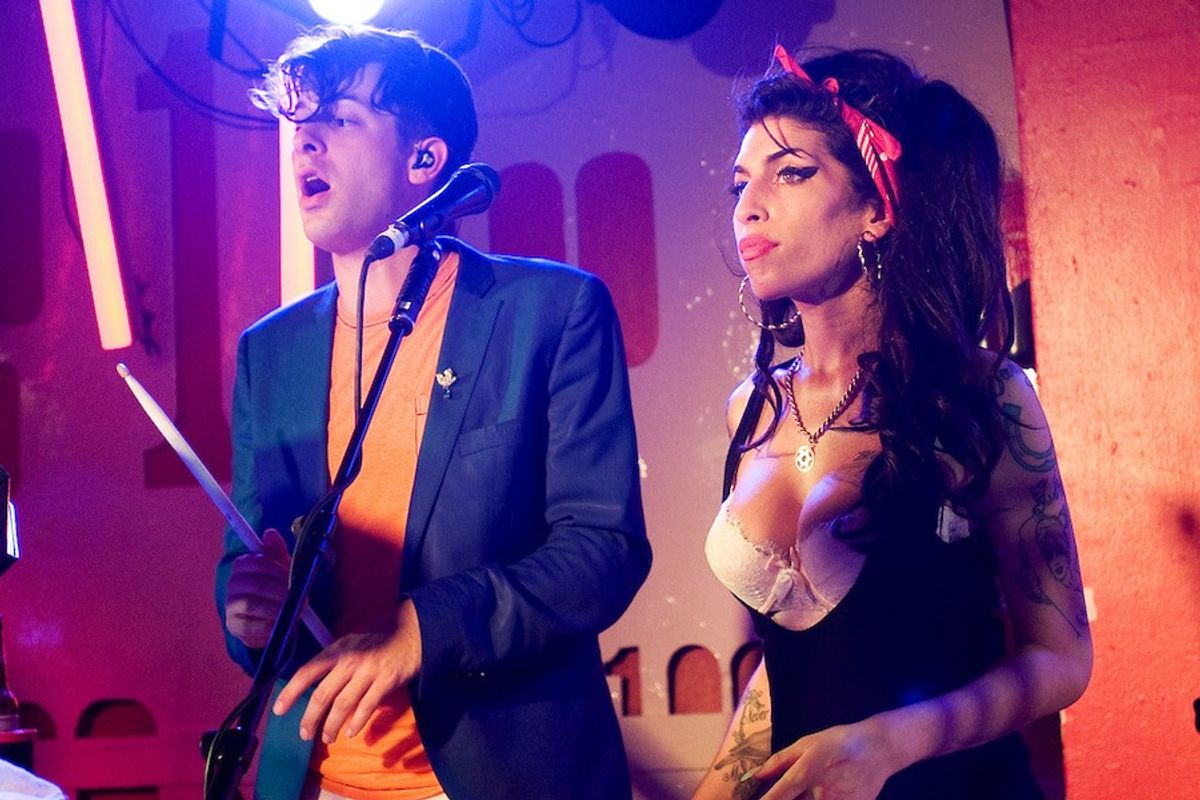 Amy Winehouse makes a surprise appearance as she performs with Mark Ronson (L) at the 100 Club on July 6, 2010 in London, England.