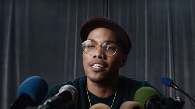 Anderson .Paak announcing his new label in a chaotic mock press briefing.