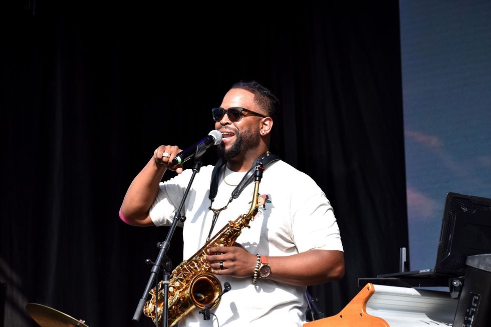BAMSFest performer and Berklee College of Music associate professor Tim Hall, plays saxophone and relays spoken word rhymes about family and music in Franklin Park, June 23, 2023.