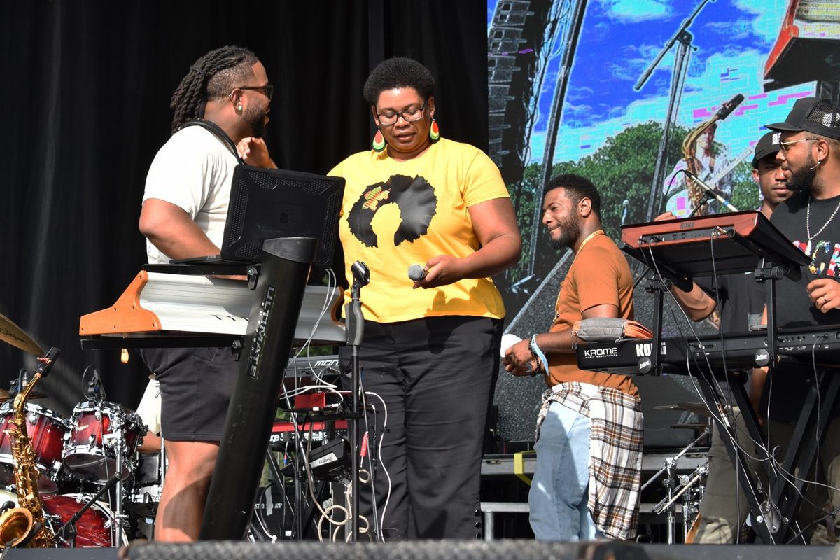 BAMSFest performer Tim Hall shares a moment with the festival’s founder, Catherine Morris, before opening with the first show of the weekend at Franklin Park, June 23, 2023. 