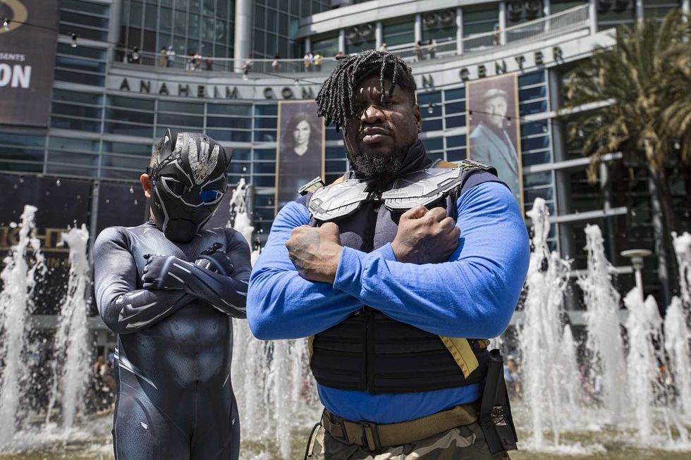 Black Panther cosplayers Brandon Jackson as Killmonger (R) and Braxton Jackson as Black Panther pose at Day 2 of WonderCon 2023 at Anaheim Convention Center on March 25, 2023 in Anaheim, California.