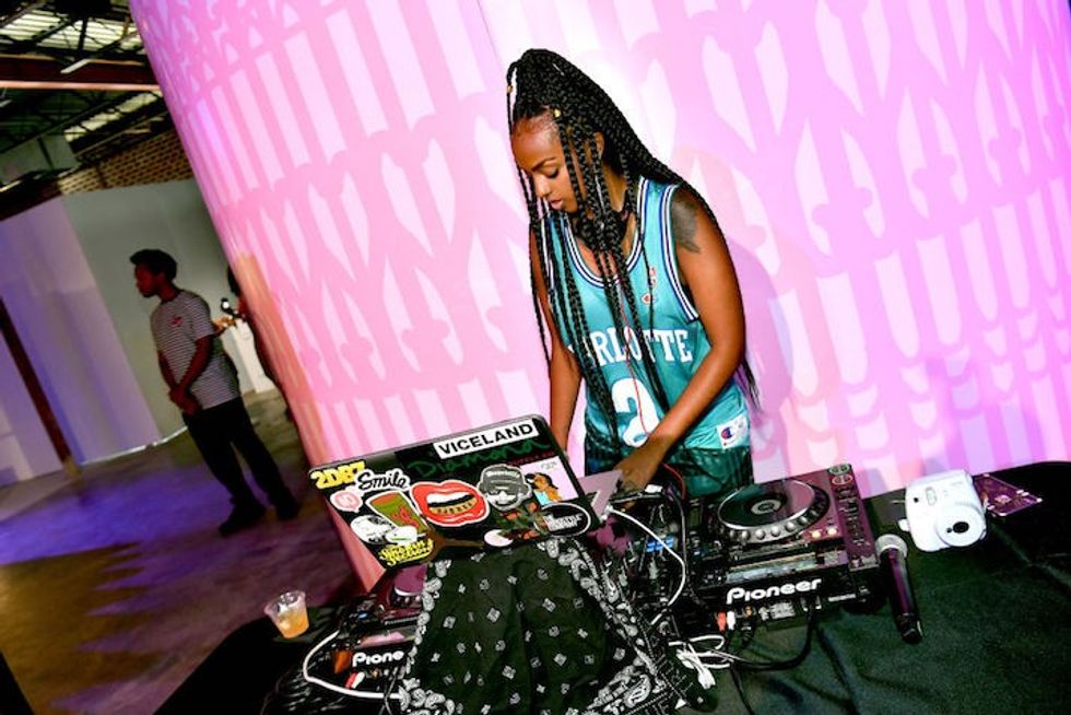 Black professionals DJ spinning