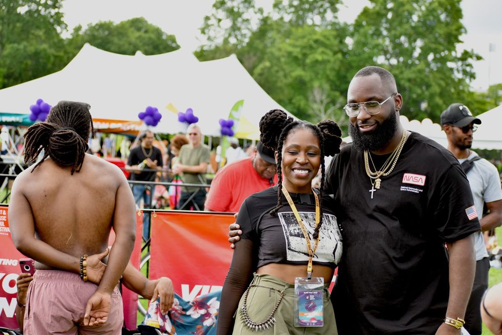 Boston artist and BAMFest performer ToriTori poses for photos with friends and family before her set in Franklin Park on June 24, 2023.