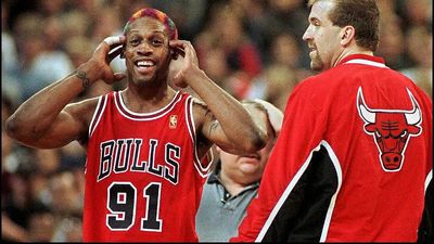 Chicago bull dennis rodmanl reacts to being thro