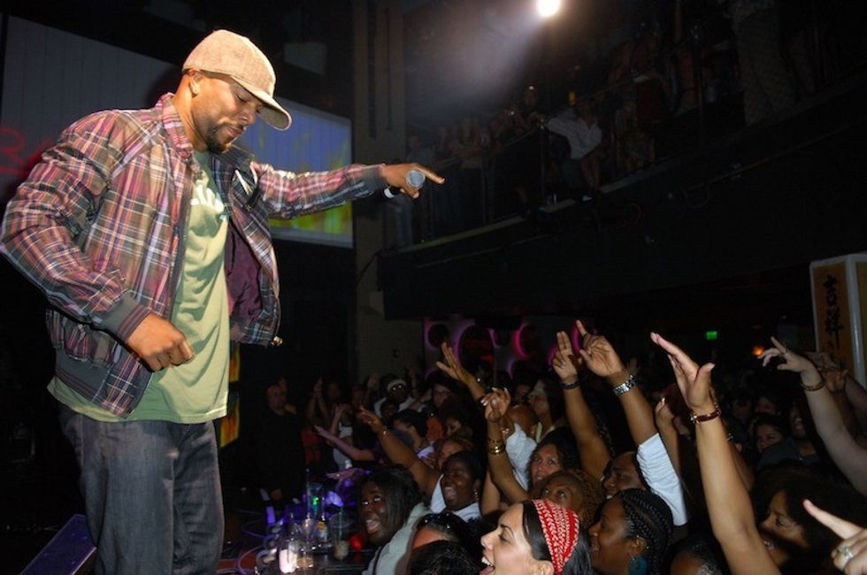 Common performing, wearing hat
