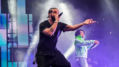 Drake 21 Savage performing with green sweater