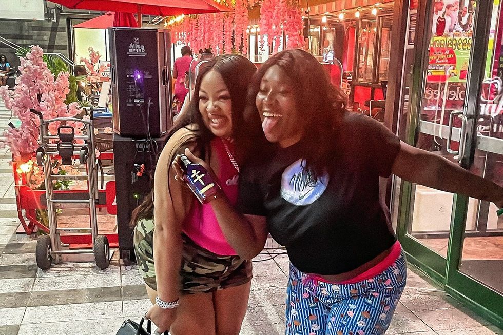 Female rapper Maiya The Don hanging out with a fan