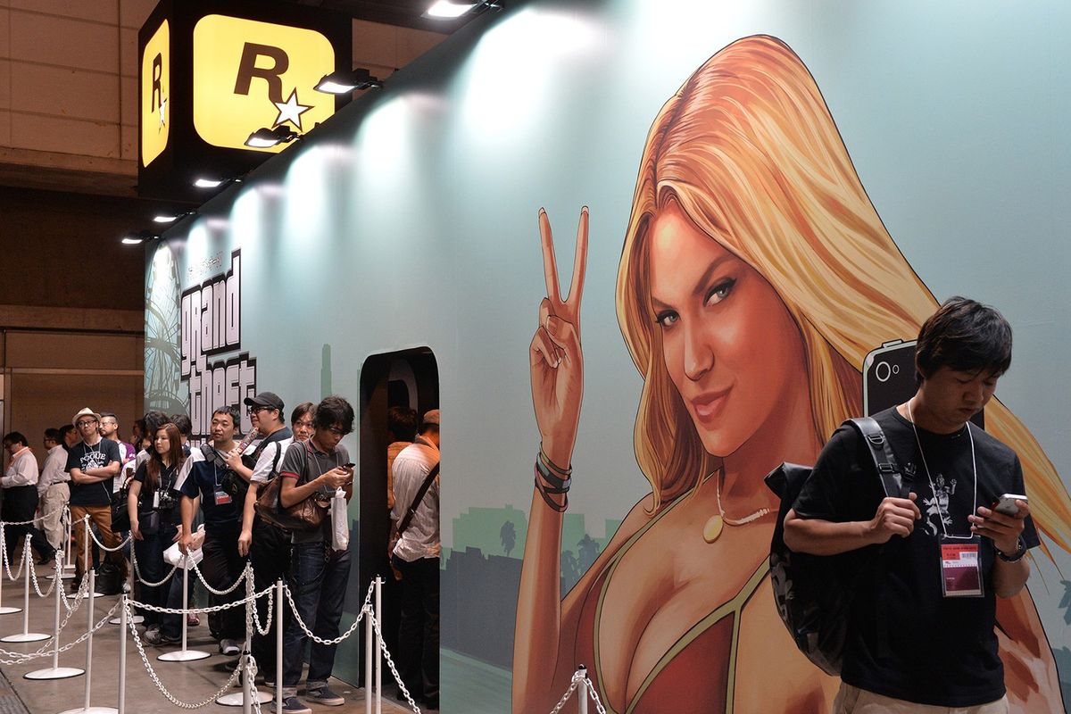 GTA fans line up outside a booth picturing the iconic swimsuit girl from the GTA V loading screens