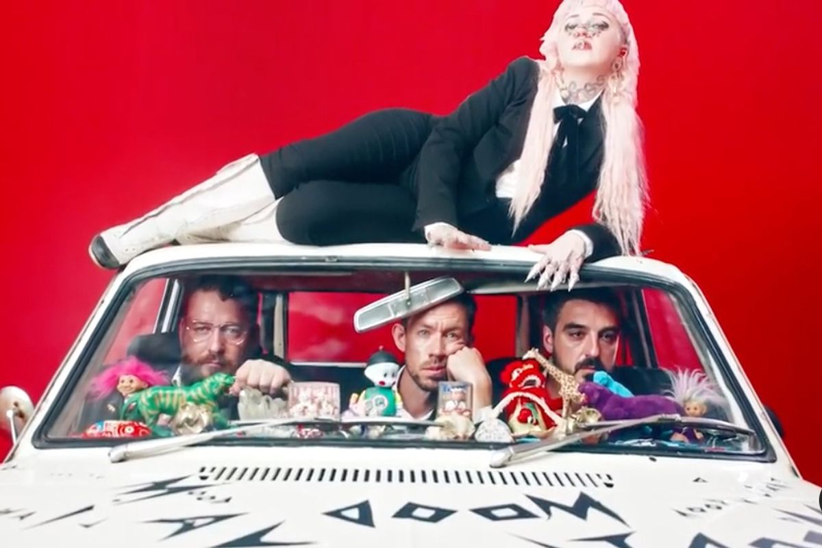 Hiatus Kaiyote packs into a tiny white car in the video for their new single "Red Room"