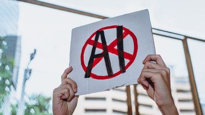 Protestor holding a "No AI" sign. 