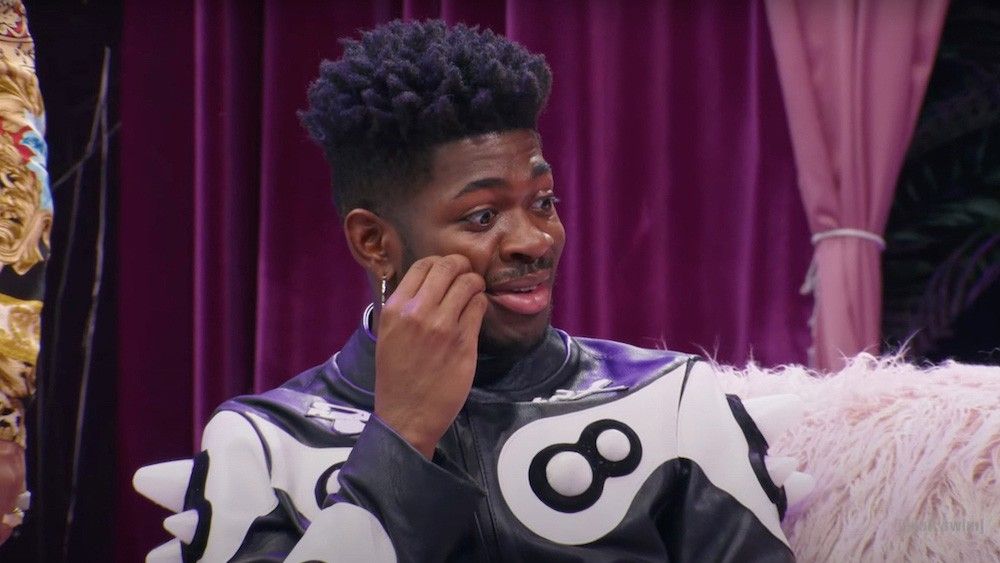 Lil Nas X looking concerned on the set of the Eric André show.