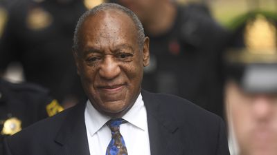 bill cosby in auit with blue tie