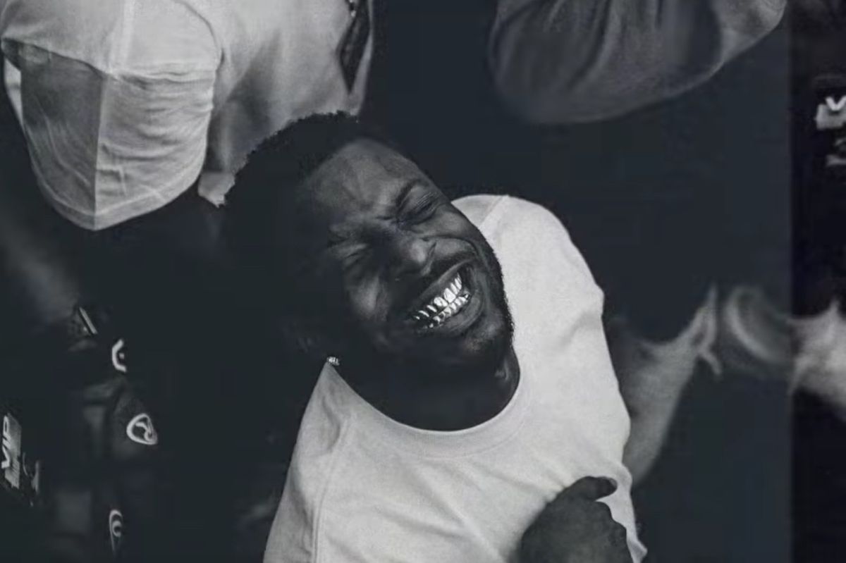 Isaiah Rashad smiles ear-to-ear in the video for his non-album single "200/Warning"