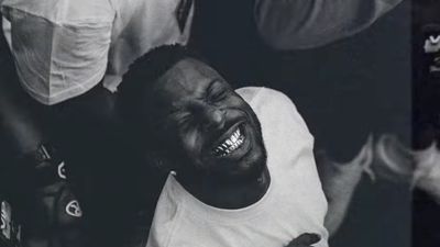 Isaiah Rashad smiles ear-to-ear in the video for his non-album single "200/Warning"
