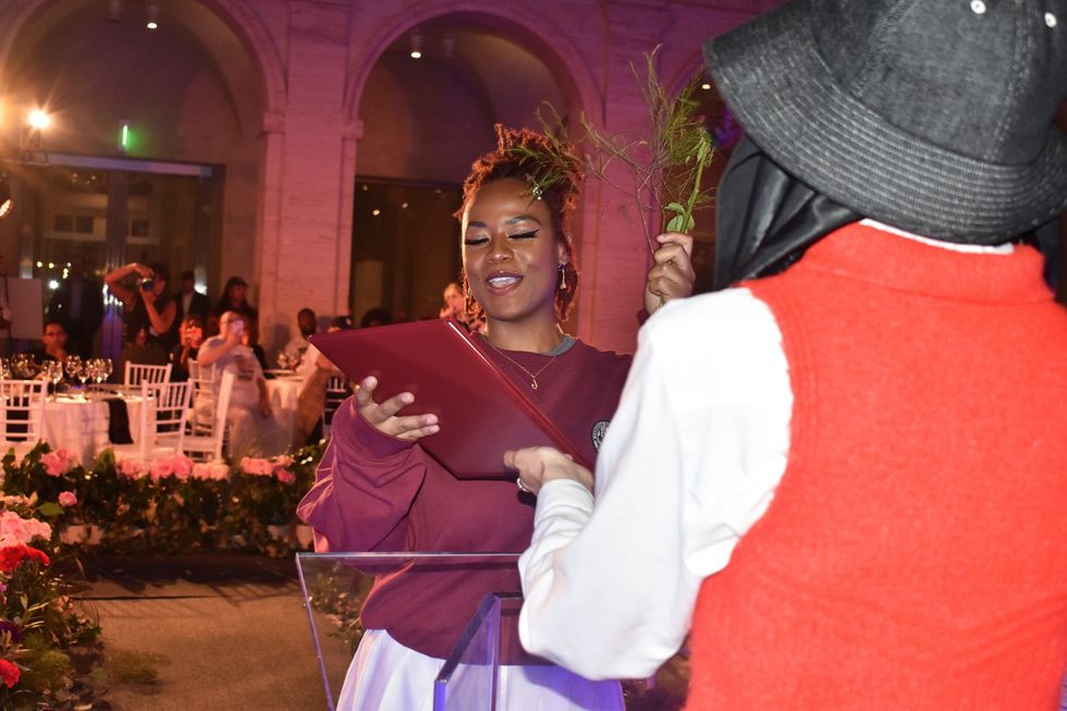 Jade \u201cMor\u201d Whaley recieves her certificate of completion of the No Label Academy program at the graduation ceremony at Harvard Art Museum on August 25, 2023.