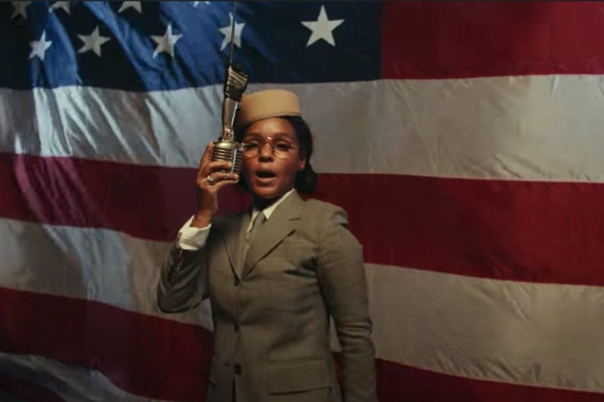 Janelle Monáe in front of american flag