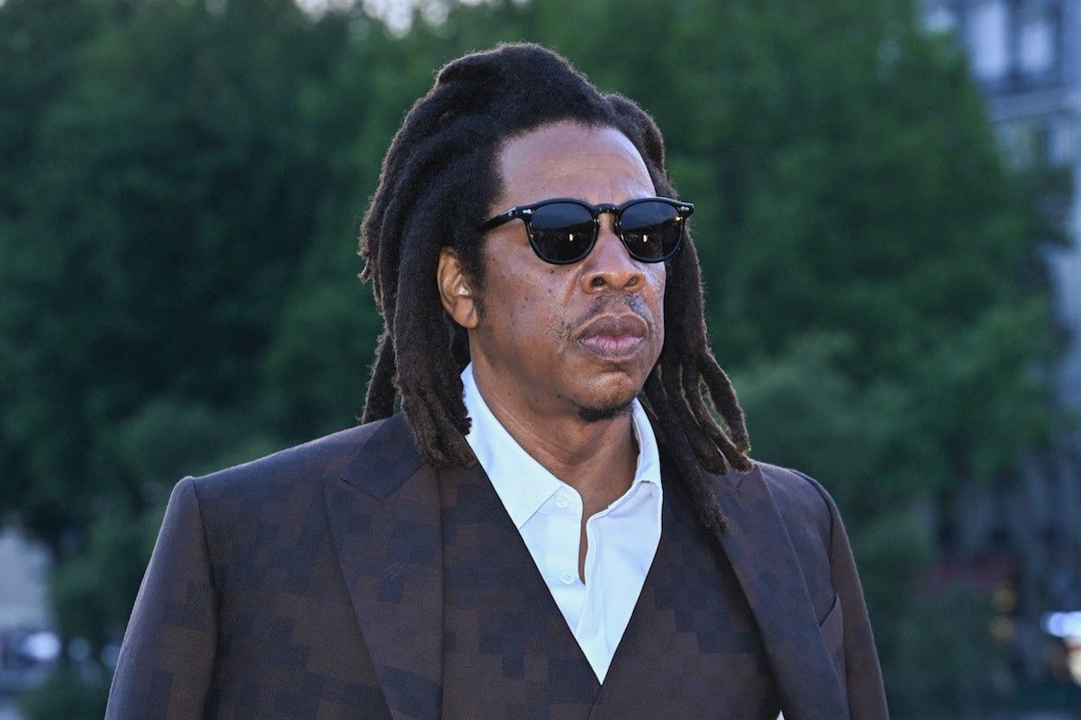 jay-z wearing glasses brown suit 