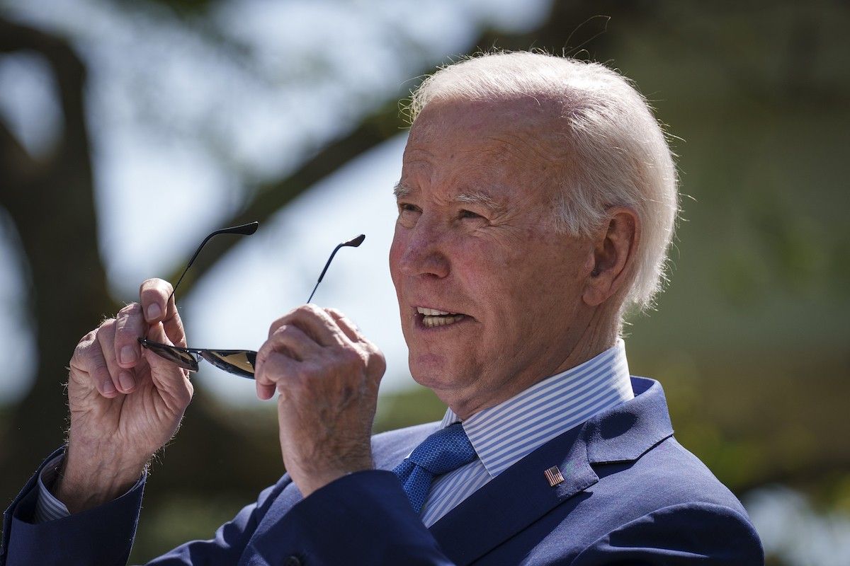 Joe Biden taking off sun glasses