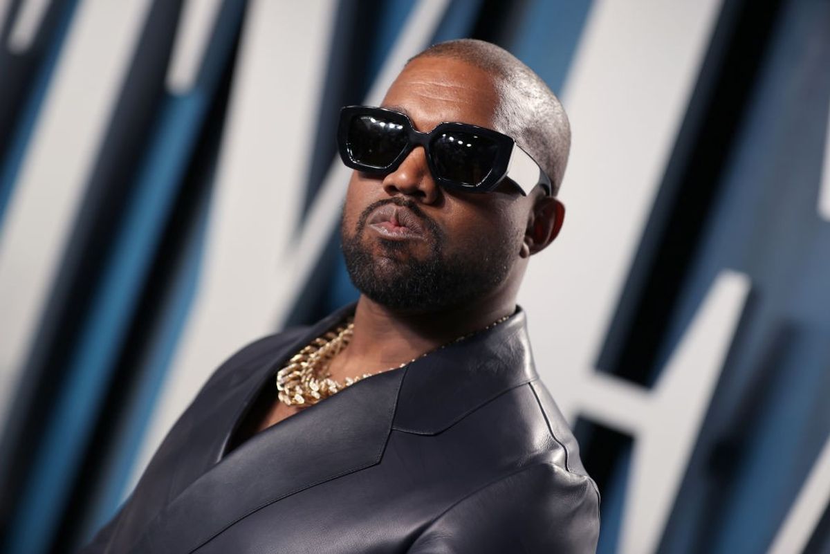 Kanye West posing with sun glasses