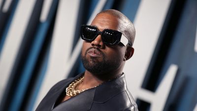 Kanye West posing with sun glasses