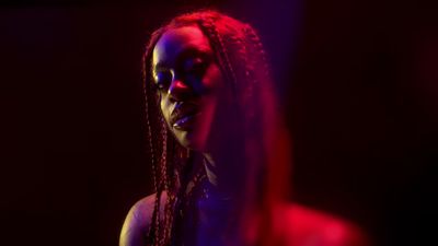 Kari Faux in the kaleidoscopic video for her new single "Outta Sight"