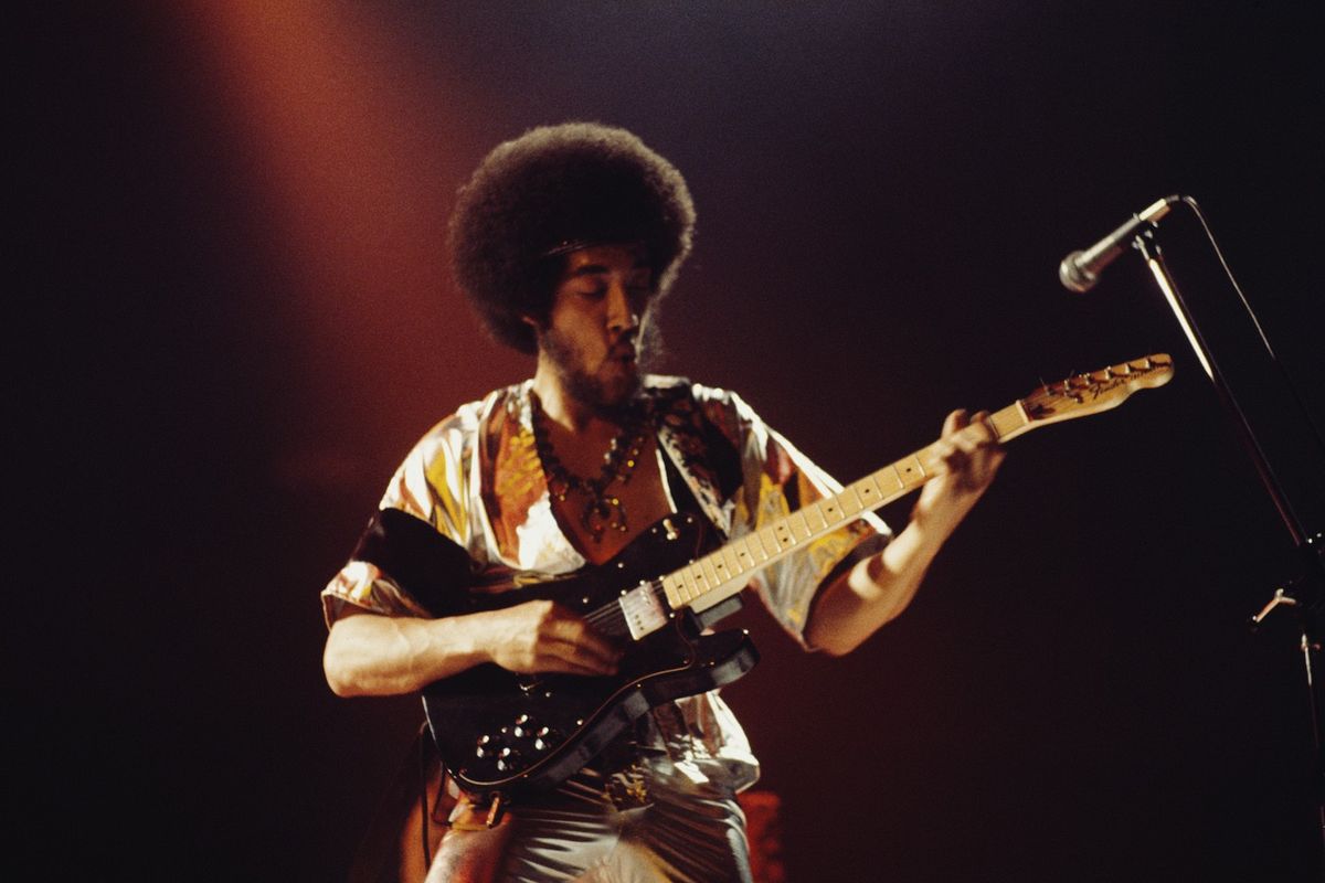 Leo Nocentelli performs live on stage with American funk group the Meters in London in 1976.