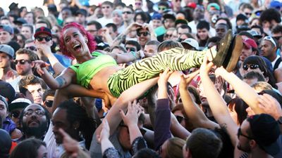 A backup dancer crowd surfs during the performance of Major Lazer at the Roots Picnic 2012 at Festival Pier on June 3, 2012 in Philadelphia, Pennsylvania. 
