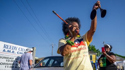 Community member Jackie Douglas celebrates after residents marched from the Galveston County Courthouse on June 19, 2022 in Galveston, Texas. Galveston island is the birthplace of Juneteenth, the oldest known nationally celebrated event commemorating the end of slavery in the United States.