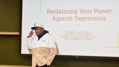 IDK introduces a guest speaker on the topic of mental health as part of No Label Academy at the Harvard Medical School on August 25, 2023. 