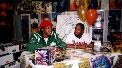 Rappers André 3000 (André Benjamin) and Big Boi (Antwan Patton) of Outkast signs autographs and greets fans at George's Music Room in Chicago, Illinois in October 1998.