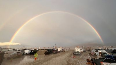  The undated image shows a rainbow seen over the muddy grounds of the "Burning Man" festival. 