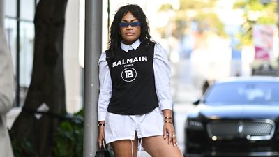 Trevian Kutti is seen wearing a Balmain top and white shirt dress on December 02, 2021 in Miami, Florida.