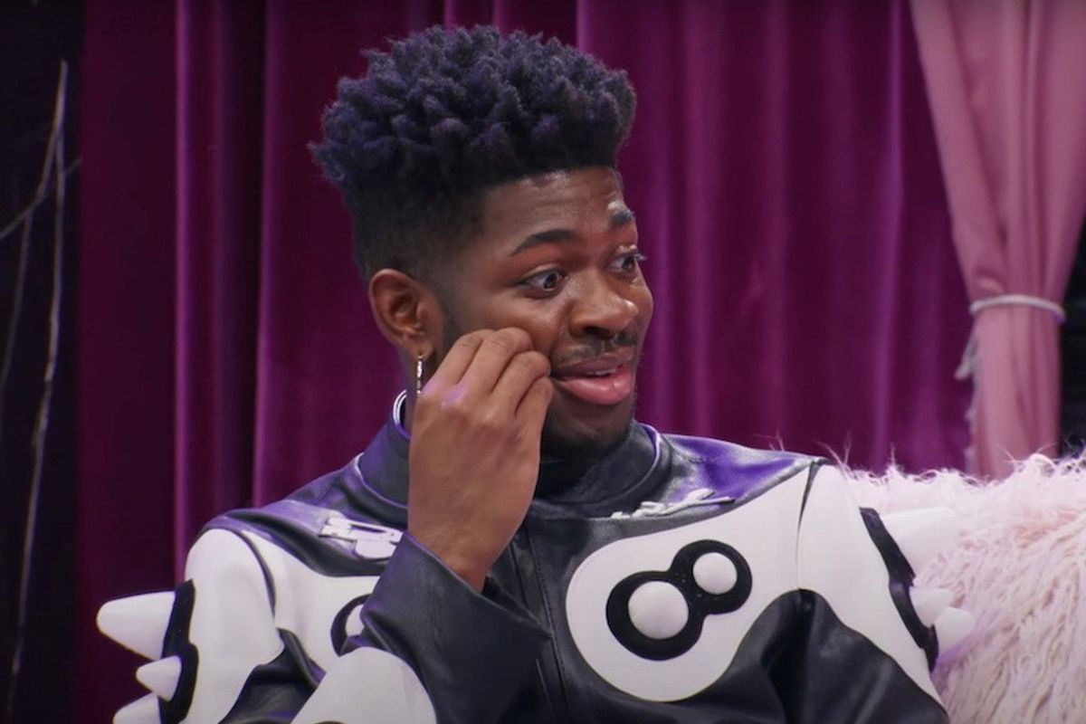 Lil Nas X looking concerned on the set of the Eric André show.