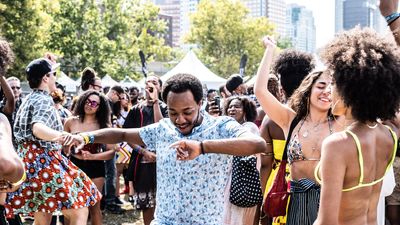 Man blue shirt dancing music festivals 2021