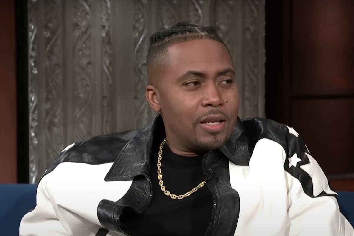 Nas on Stephen Colbert with black and white jacket