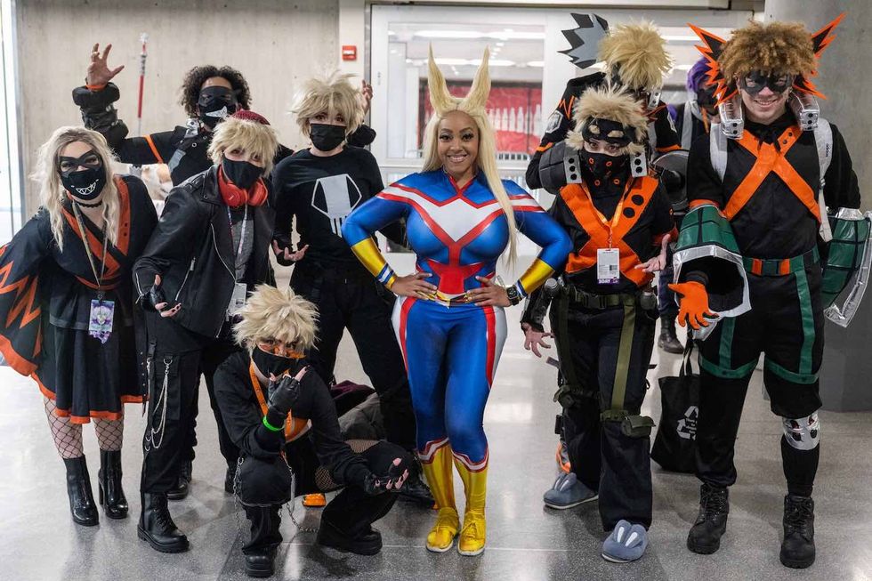 People dressed in costumes pose during the 5th annual Anime NYC at the Jacob K. Javits Convention Center on November 18, 2022 in New York City. Over 50,000 fans are expected during the three-day convention which is a three-day celebration of Japanese animation and culture.