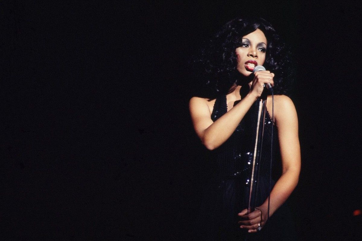 Queen of Disco' Donna Summer performs onstage in a slinky black dress at the Civic Center on March 26, 1978 in Atlanta, Georgia (Michael Ochs Archives/Getty Images).