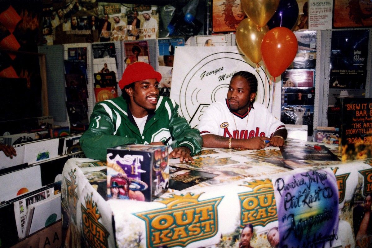 Rappers André 3000 (André Benjamin) and Big Boi (Antwan Patton) of Outkast signs autographs and greets fans at George's Music Room in Chicago, Illinois in October 1998.