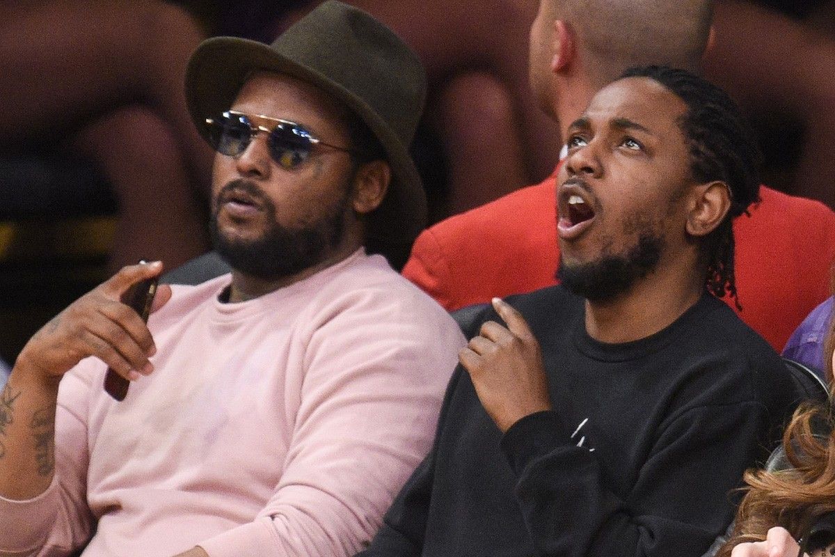 ScHoolboy Q (L) and Kendrick Lamar attend a basketball game between the Utah Jazz and the Los Angeles Lakers at Staples Center on April 13, 2016 in Los Angeles, California.