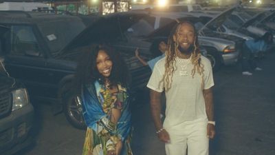 Singers SZA, wearing blue, and Ty Dolla $ign in all-white