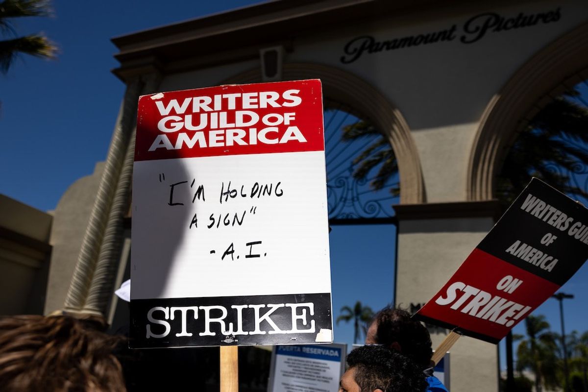 Someone carried a sign with the statement, "I'm Holding a Sign - A.I.," while members of the Writers Guild of America (WGA), joined by members of the Screen Actors Guild (SAG) and American Federation of Television and Radio Artists (AFTRA), come together to picket in front of Paramount Studios, in Los Angeles, CA, Wednesday, July 26, 2023.