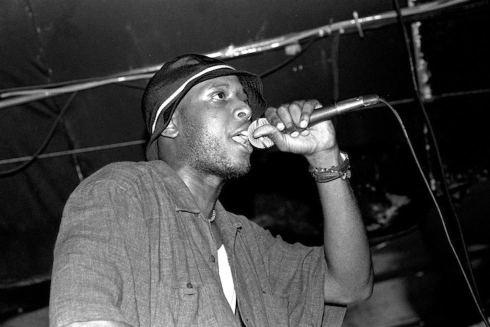Talib Kweli performing holding mic best rap verses