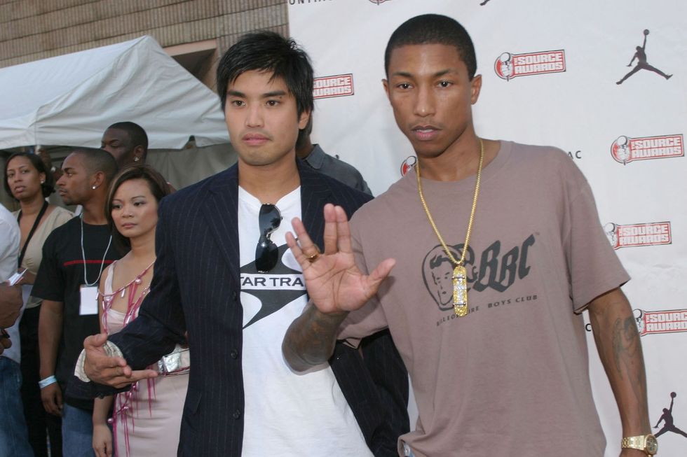 The neptunes throwing up sign