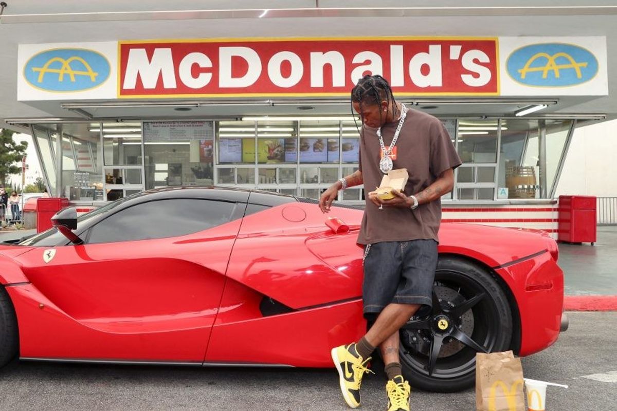 Travis scott surprises crew and customers at mcdonalds for the launch of the travis scott meal