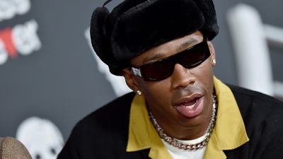 Tyler, the Creator wearing sunglasses and a hat